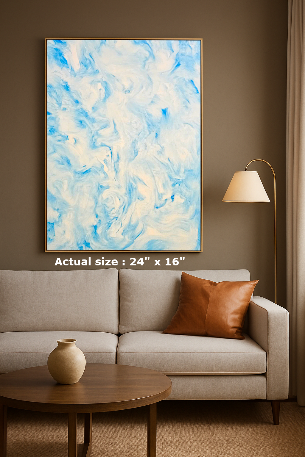 Abstract painting on a wall above a sofa with a lamp and table.